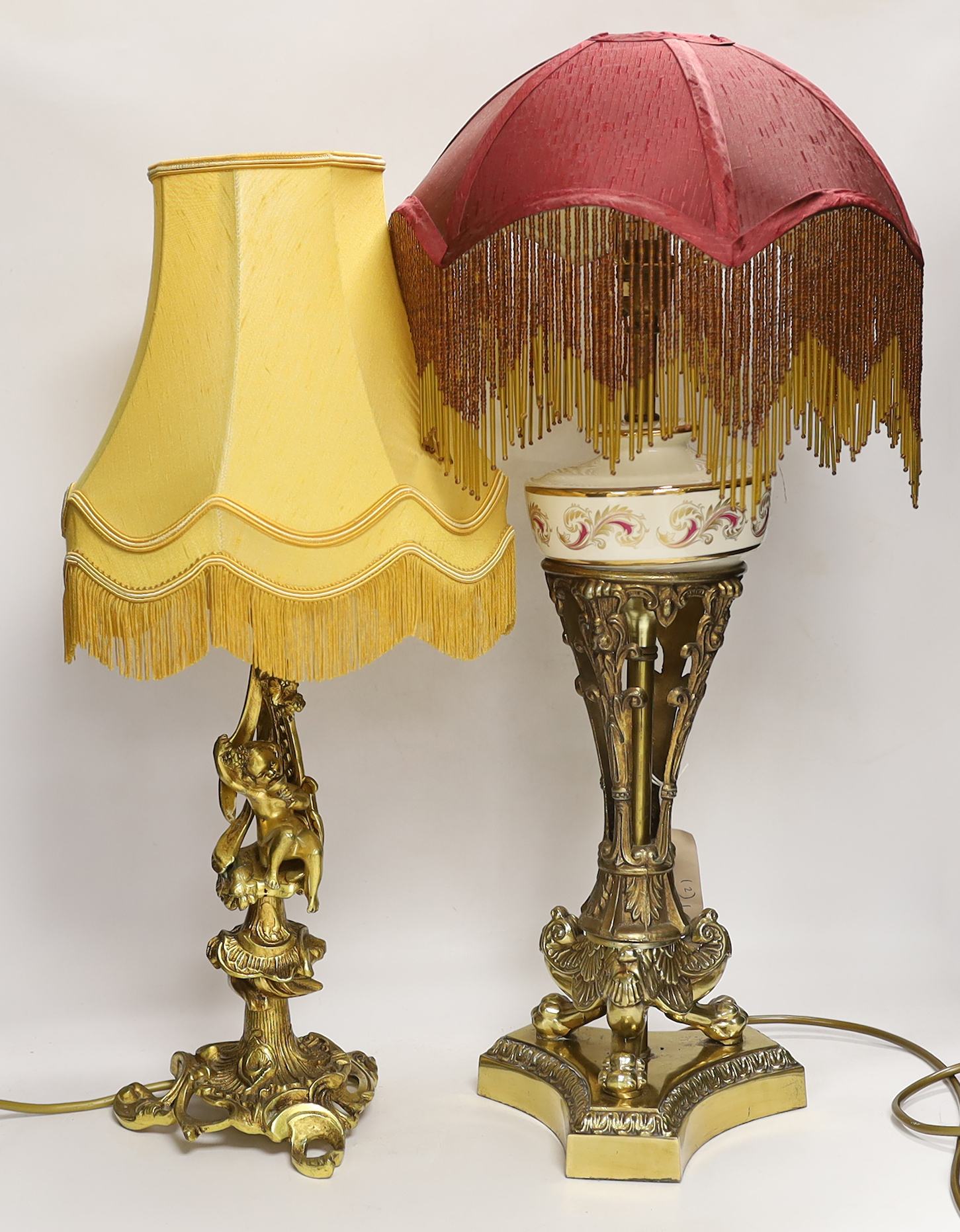 A Victorian-style brass and ceramic table lamp with beaded shade, and one other with cherub figure, tallest 62cm